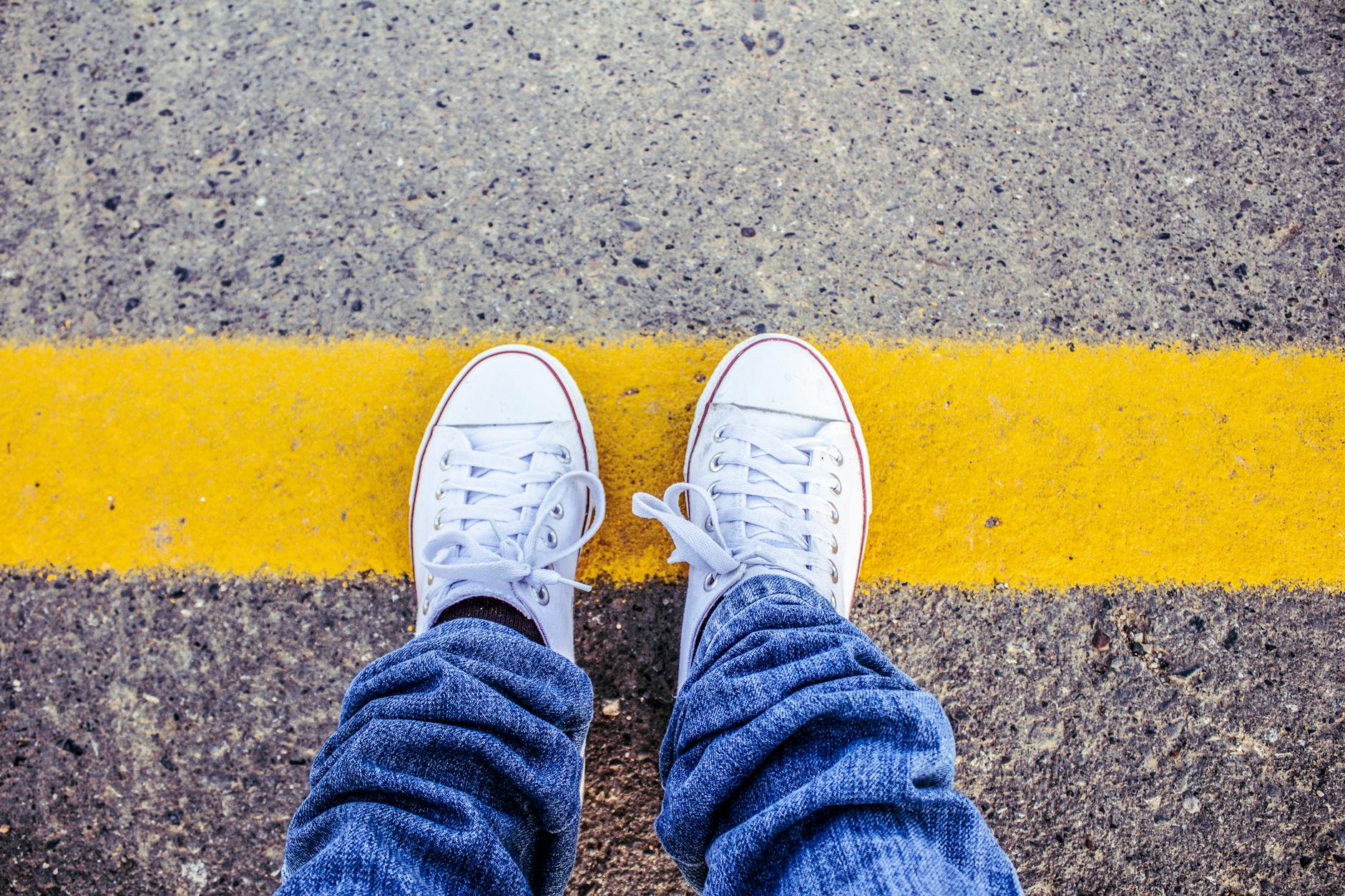 person wearing white sneakers